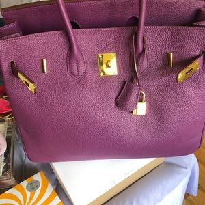 Used once aliexpress handbag color is purple and it’s real leather